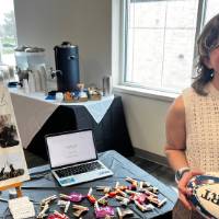 Nicki Parthun standing at booth